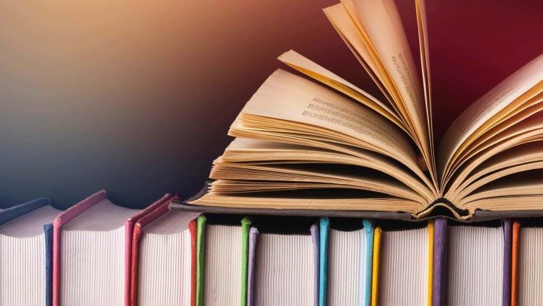 books lined up in bookshelve