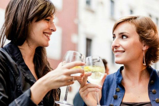 2 women drinking white wine