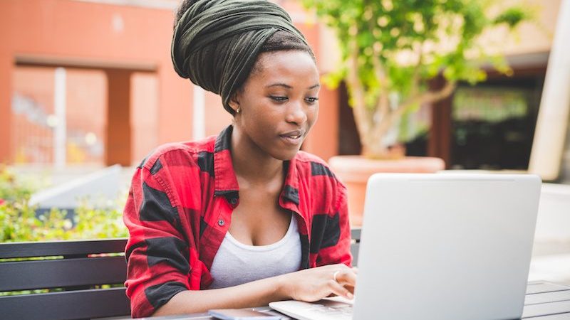 woman of colour on laptop