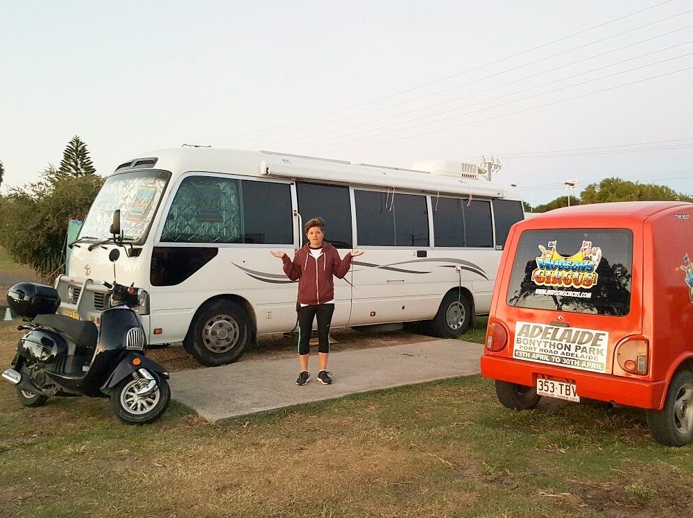 Jot in front of a bus