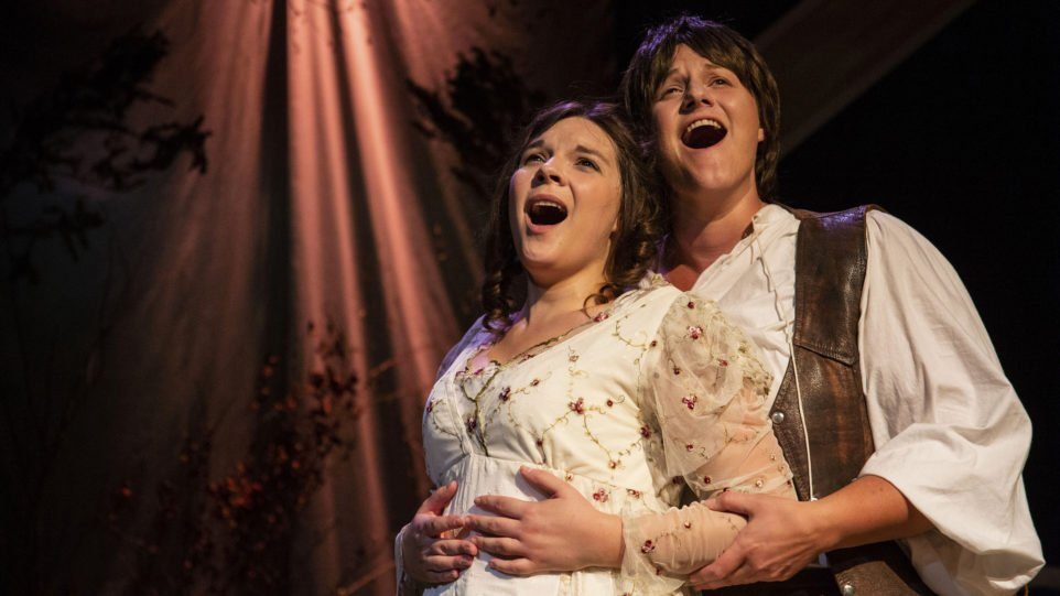 The titular couple (Angela Born as Patience, Jenna Schroer as Sarah) embraces in Third Eye Theatre Ensemble's production of Patience & Sarah. (Photo: Clint Funk)