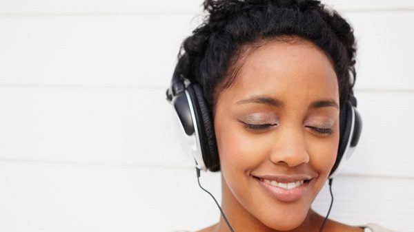 woman with headset listening to music