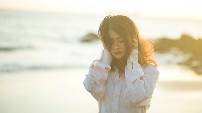 sad woman on beach