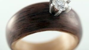 Walnut and Maple engagement ring with salvaged diamond setting