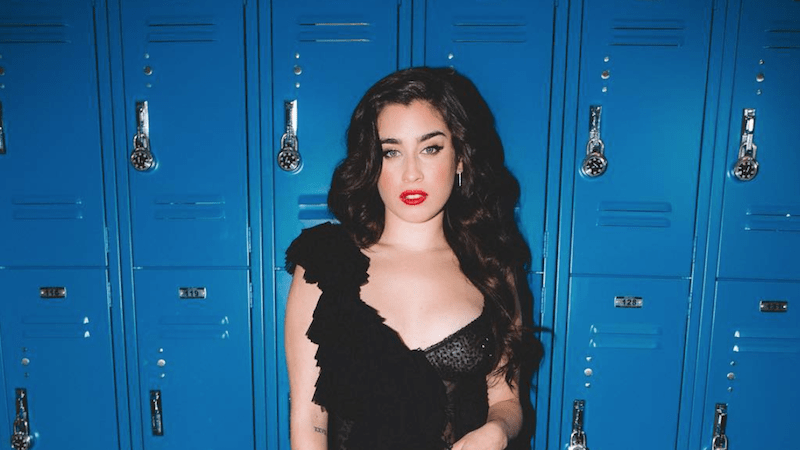 Lauren Jauregui in front of blue lockers