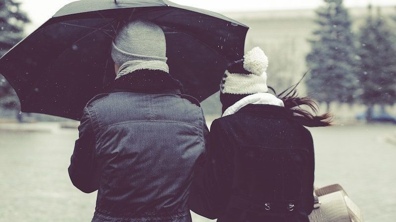 2 people with umbrella