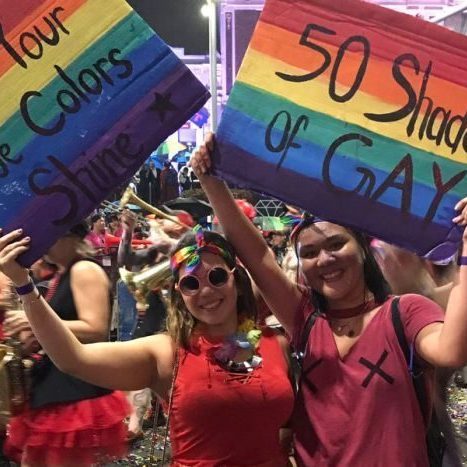 2 women in red Pride parade