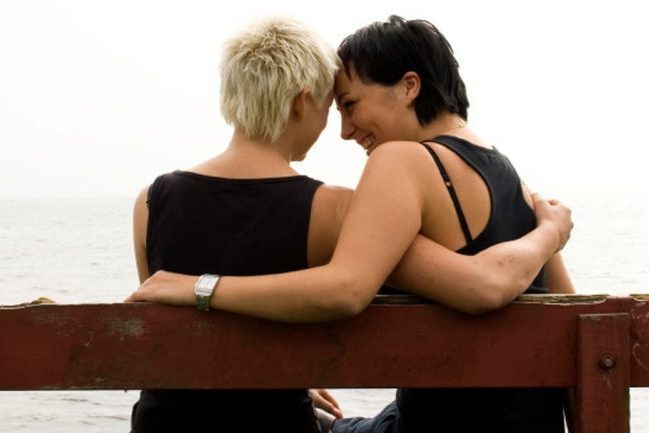 2 women sitting on a bench