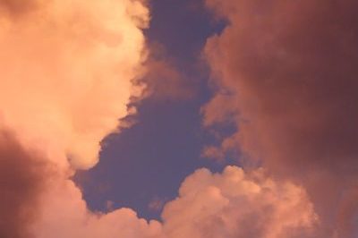 Blue Sky opens up through dark clouds