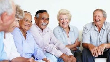 Group of seniors sitting and laughing