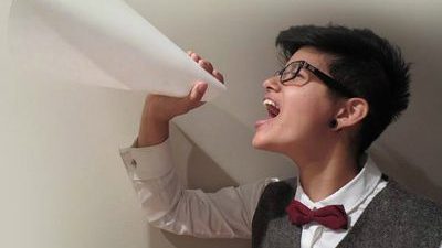 Woman screaming through megaphone