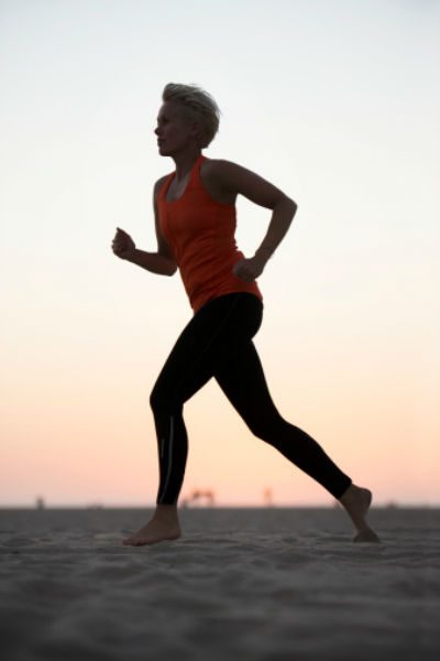 woman jogger on beach